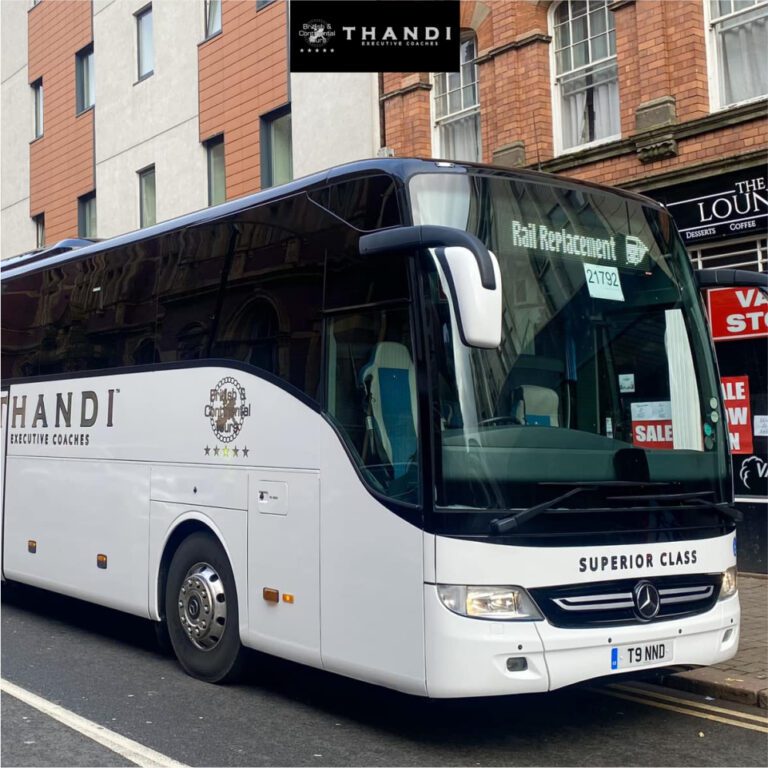 Luxury executive coach parked on a city street