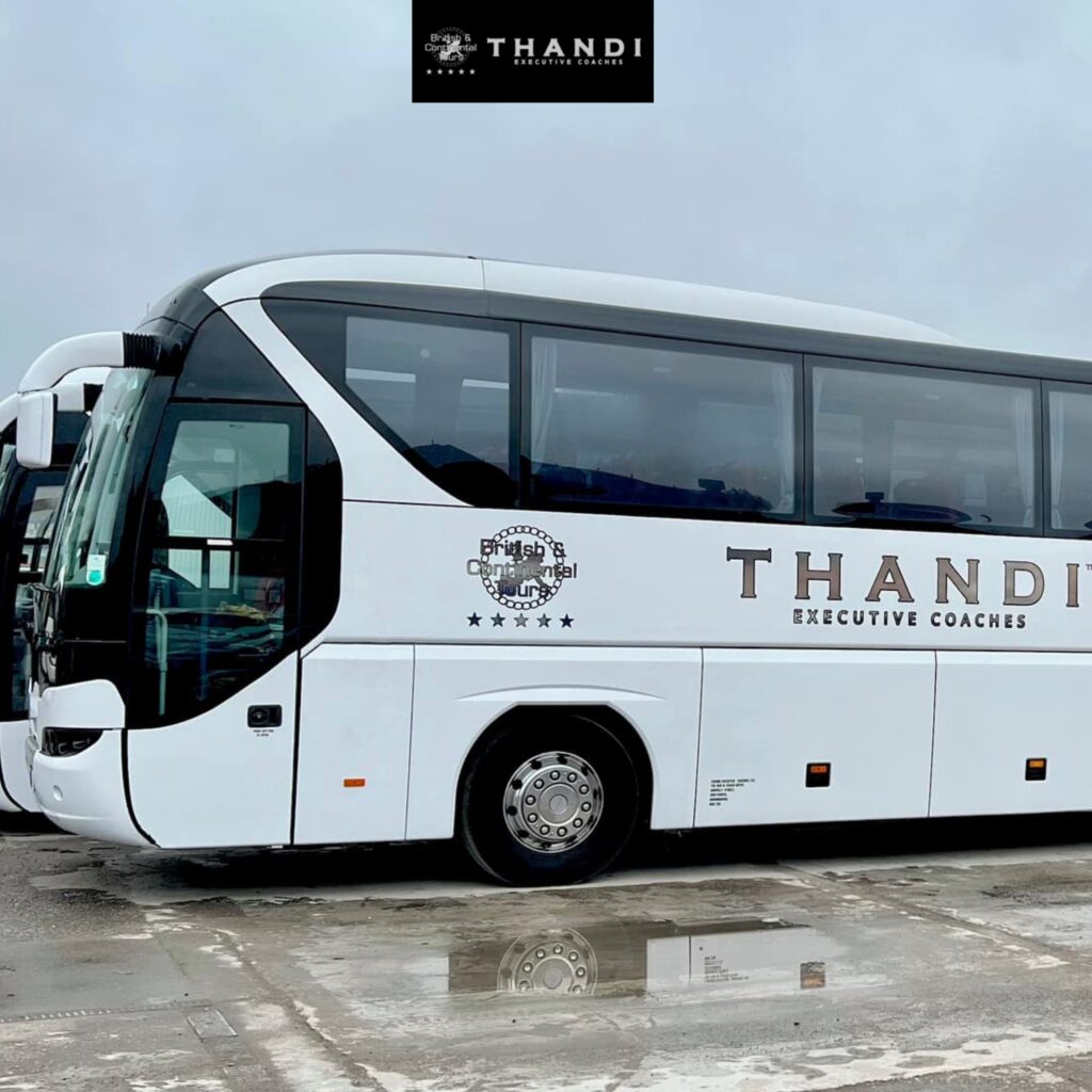 Luxury white coach bus with Thandi Executive Coaches branding