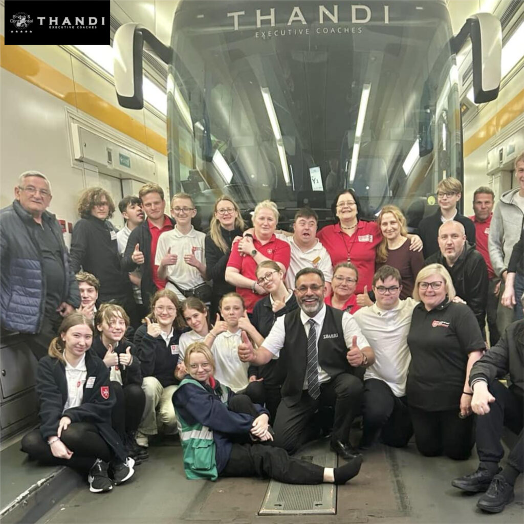 Thandi Executive Coaches team and passengers posing together inside luxury coach
